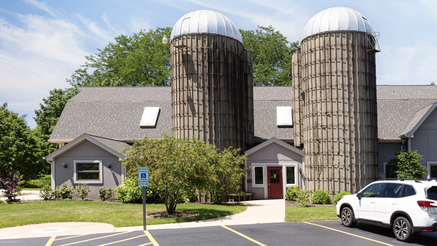 A commercial building with a brown roof in Wheaton, IL by Apex Exteriors.