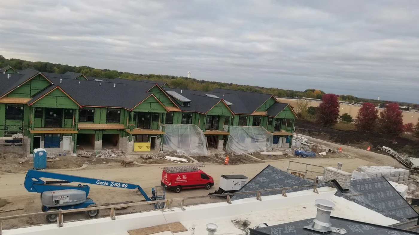 A sky view of a multi-family building under construction in Bloomingdale, IL by Apex Exteriors.