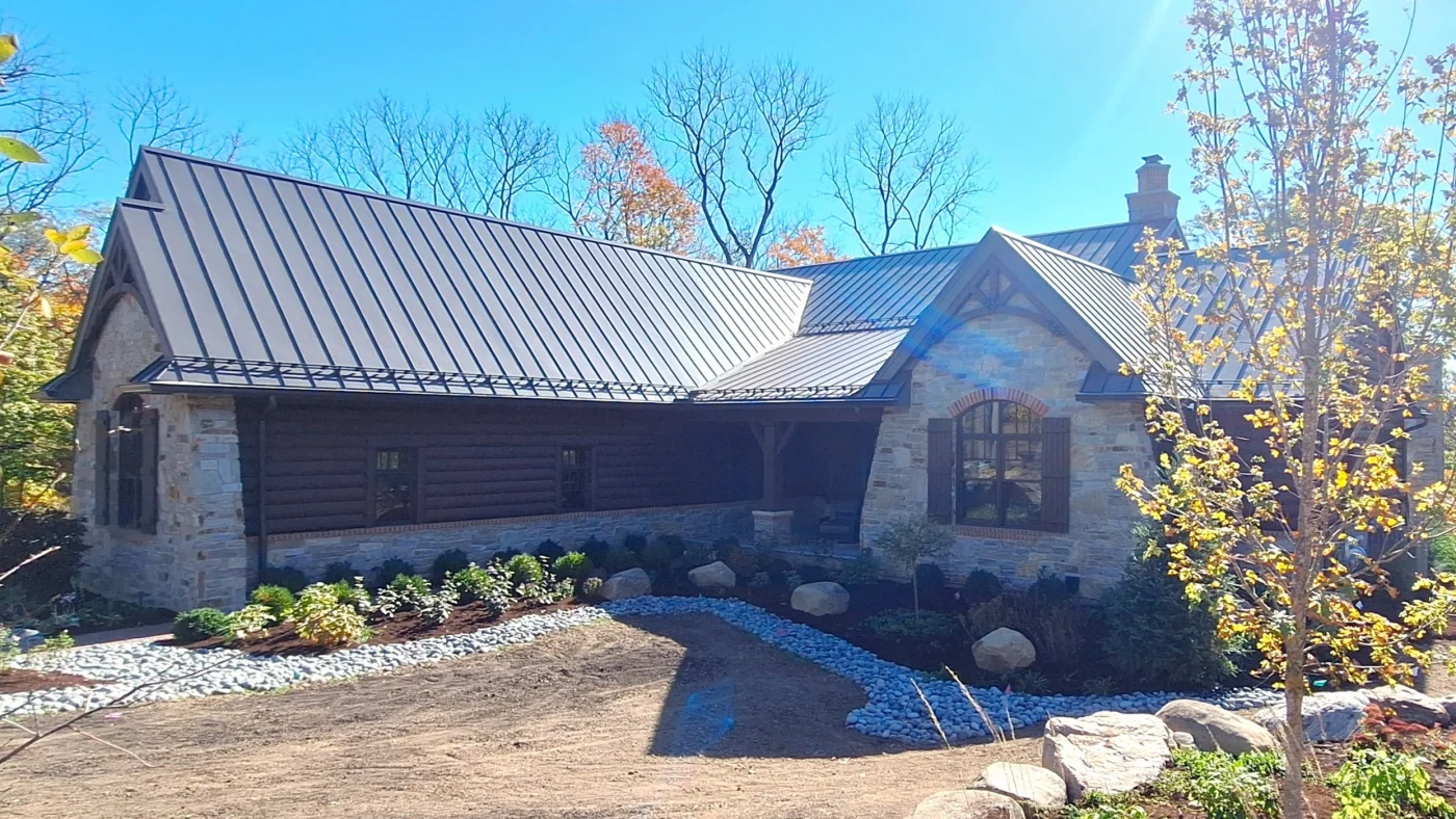 The front of a mostly brick home with some brown siding in Lombard, IL by Apex Exteriors.