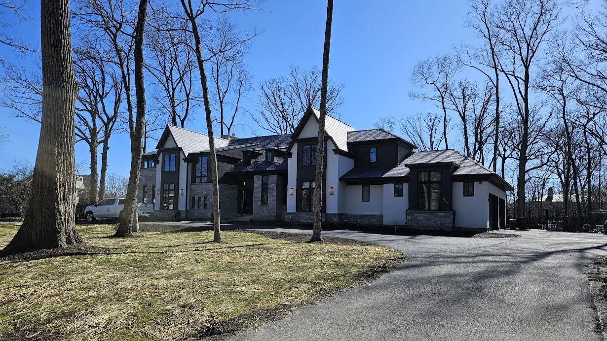 A large house with multi-color siding in Bloomingdale, IL by Apex Exteriors.