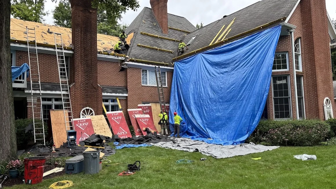 Reliable Roofing Pros Glen Ellyn Il Apex Exteriors A roofing crew working to install a new roof on a house in Glen Ellyn, IL by Apex Exteriors