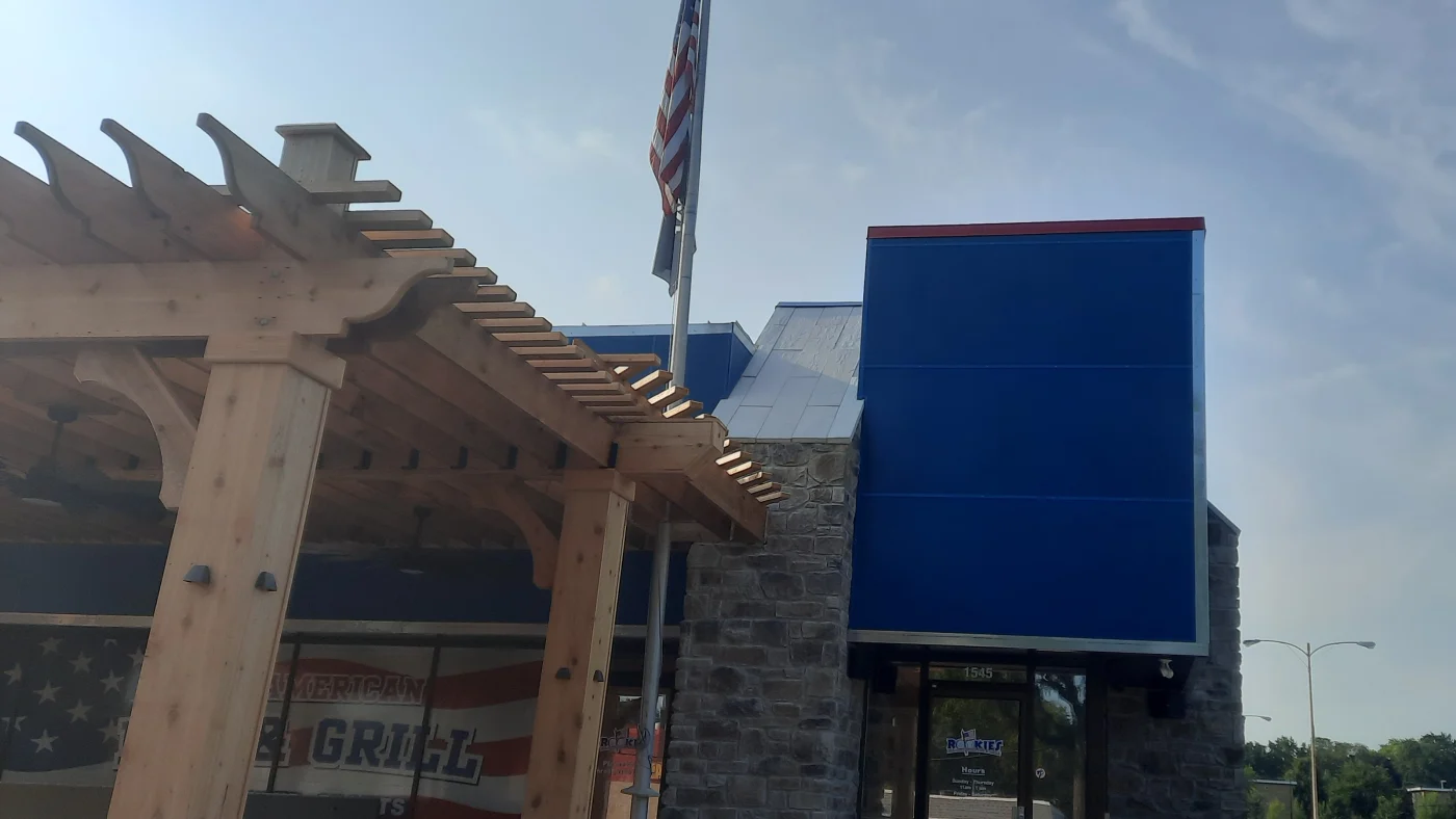 The front of a commercial building during a siding replacement in Wheaton, IL by Apex Exteriors.