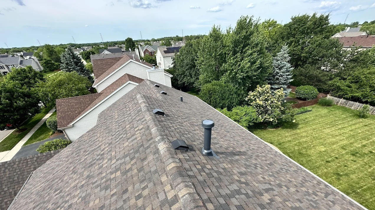 Stellar Slate Roofing Pros Glen Ellyn Il Apex Exteriors A roofer installing shingles in Glen Ellyn, IL by Apex Exteriors