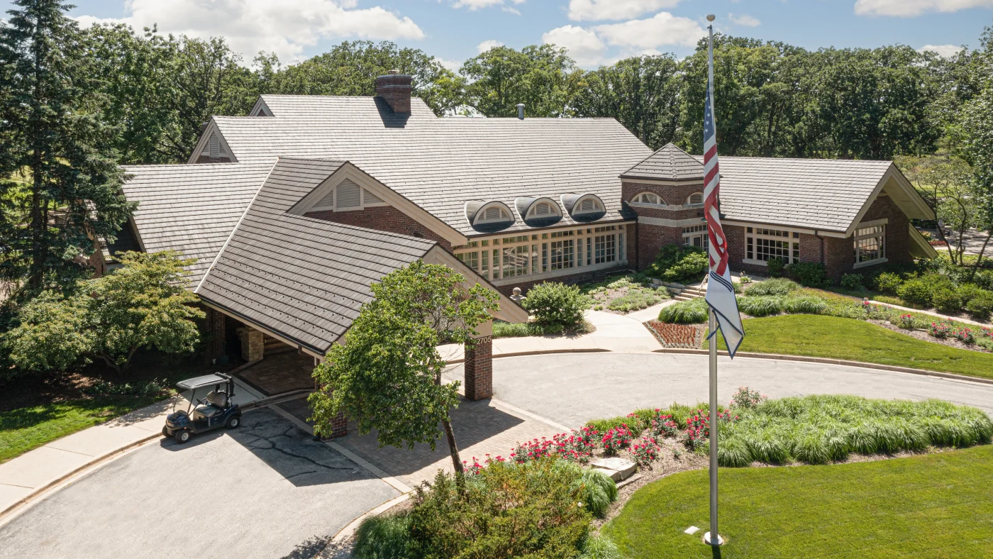 Dependable Commercial Roofing Experts | Plainfield, IL | Apex Exteriors, Inc. A commercial building with a gray roof in Plainfield, IL, by Apex Exteriors, Inc.