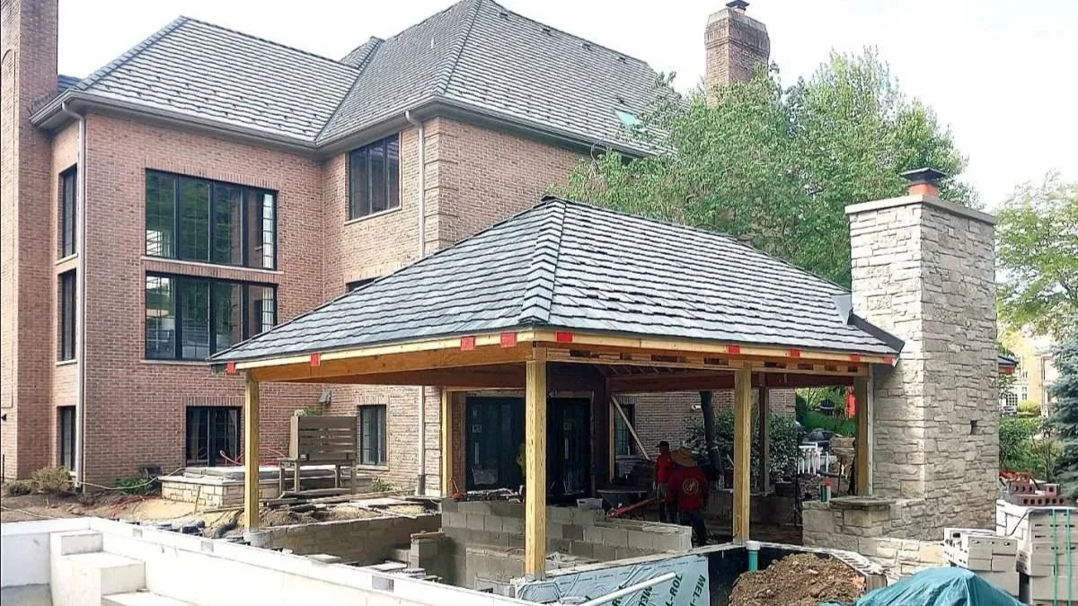 A crew works outside a home in Elk Grove Village, IL, by Apex Exteriors, Inc.