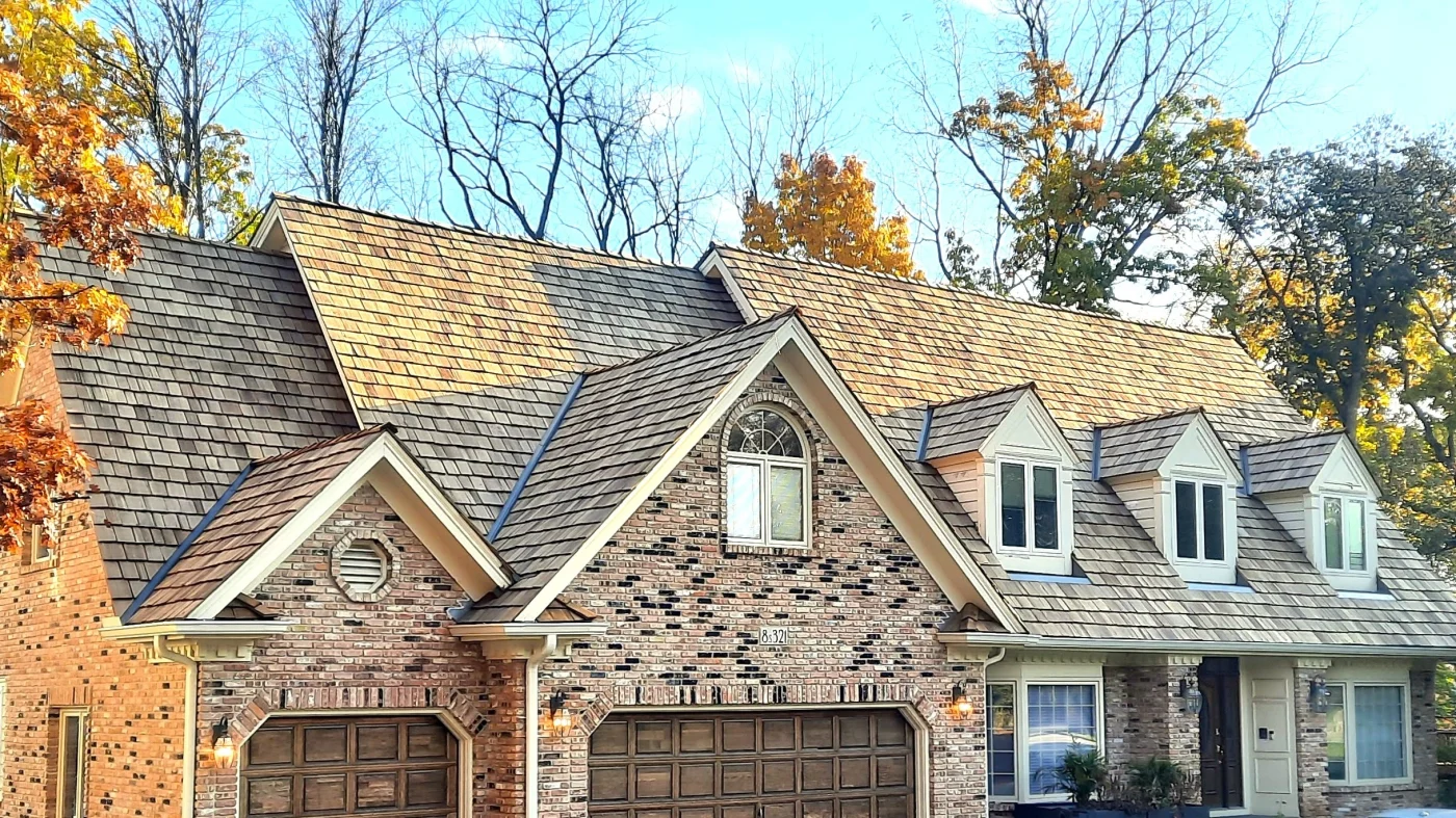 The front of a house a light brown roof in Wheaton, IL, by Apex Exteriors, Inc.