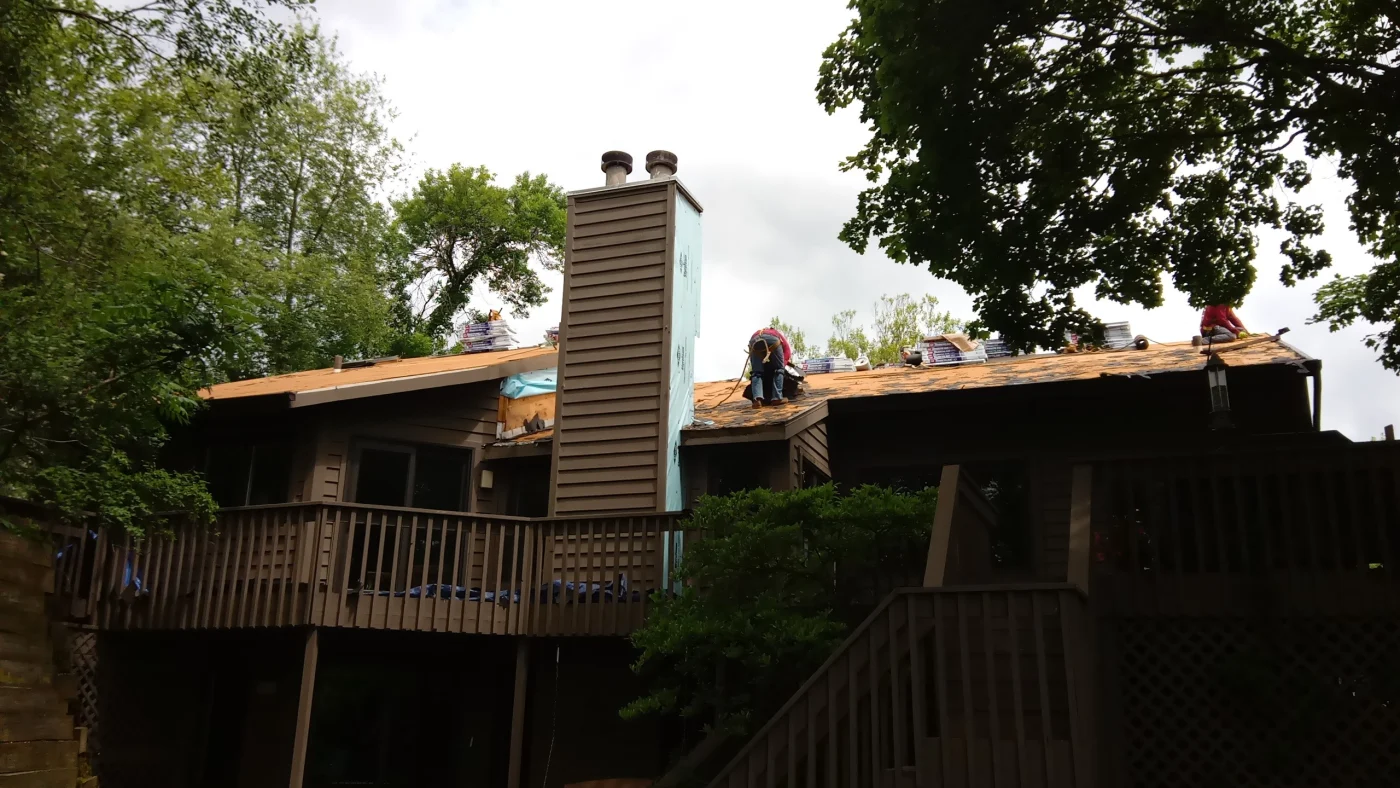 https://apexext.com/blog/need-permit-roof-replacement-cook-county-buffalo-grove-il/ Roofers working to install a roof in Buffalo Grove, IL, by Apex Exteriors, Inc.
