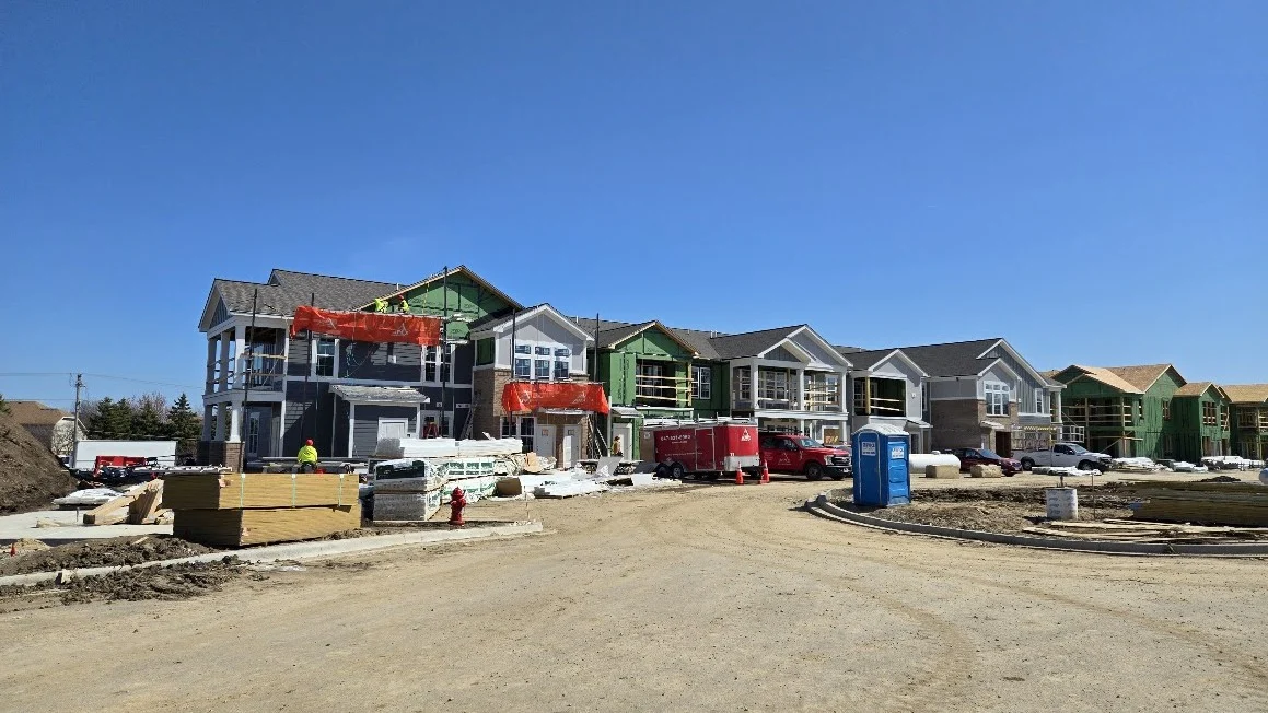 Masterful Commercial New Construction | Plainfield, IL | Apex Exteriors, Inc. A row of houses under construction in Plainfield, IL, by Apex Exteriors, Inc.