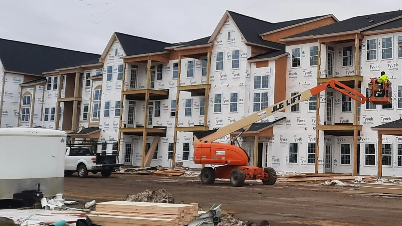 Masterful Multi-Family Exterior Experts | Plainfield, IL | Apex Exteriors, Inc. The front of a multi-family building under construction in Plainfield, IL, by Apex Exteriors, Inc.