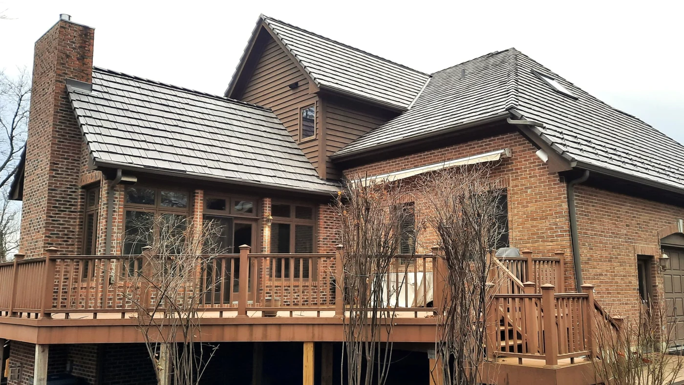 Masterful Roofing Experts | Bloomingdale, IL | Apex Exteriors, Inc. A house with brown siding and a brown roof in Bloomingdale, IL, by Apex Exteriors, Inc.