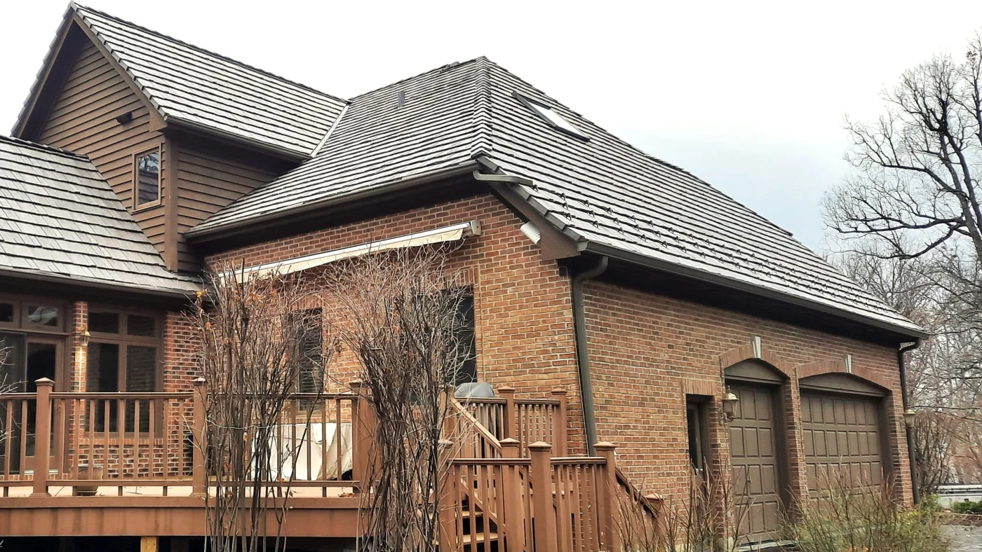 A house with brown siding and a brown roof in Elmhurst, IL, by Apex Exteriors, Inc.