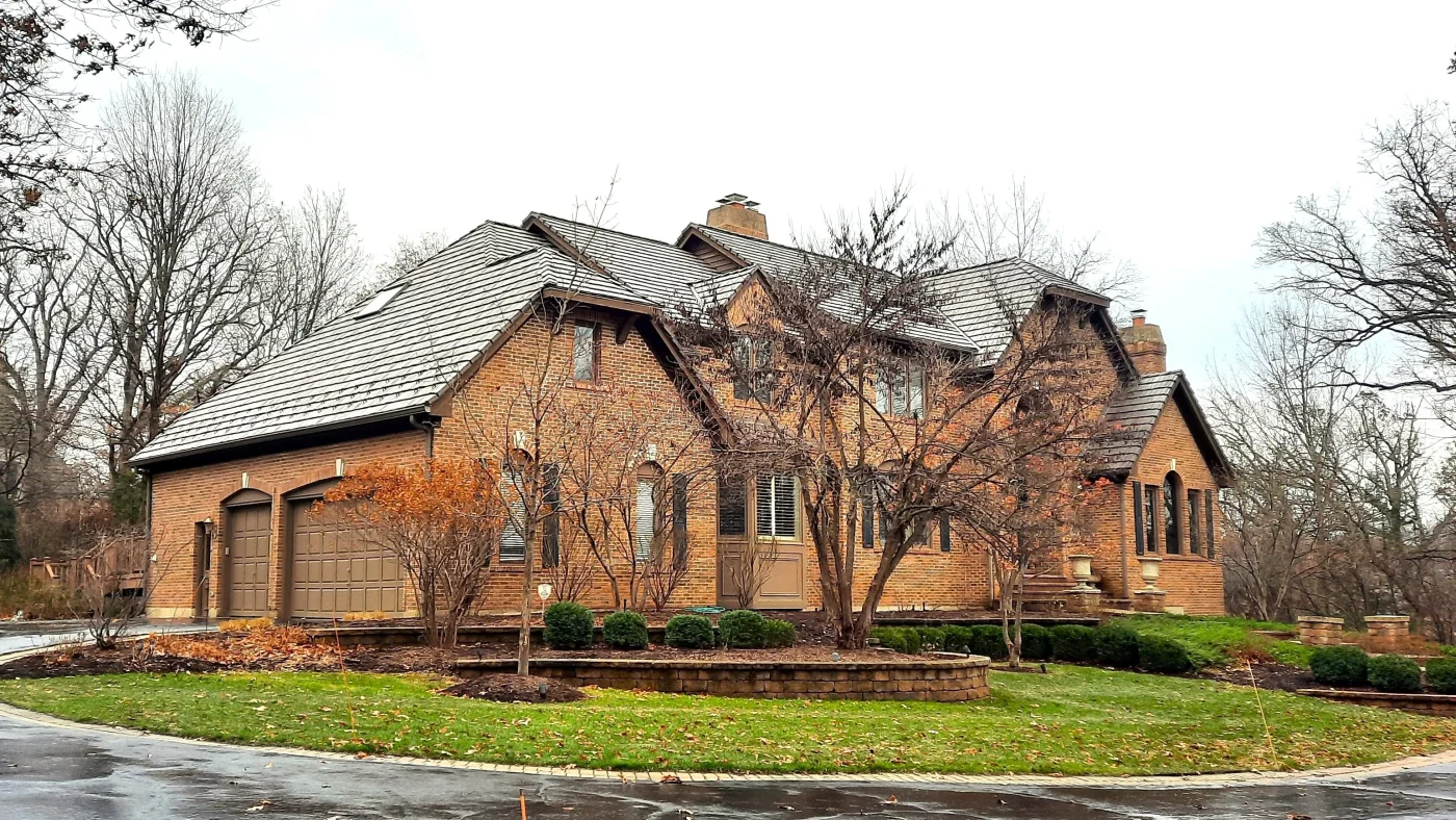 A house with orange siding and a brown roof in Glenview, IL, by Apex Exteriors, Inc.