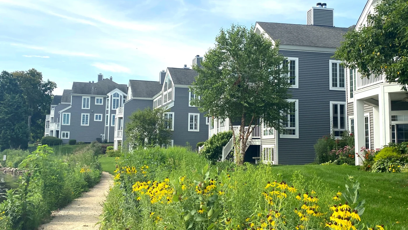 Reliable HOA Exterior Services | Plainfield, IL | Apex Exteriors, Inc. Multiple housing units with gray siding and white trim in Plainfield, IL, by Apex Exteriors, Inc.