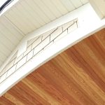 A close-up above of an entry door of the siding and part of the underside of the roof on a house in Chicago, IL, by Apex Exteriors, Inc.