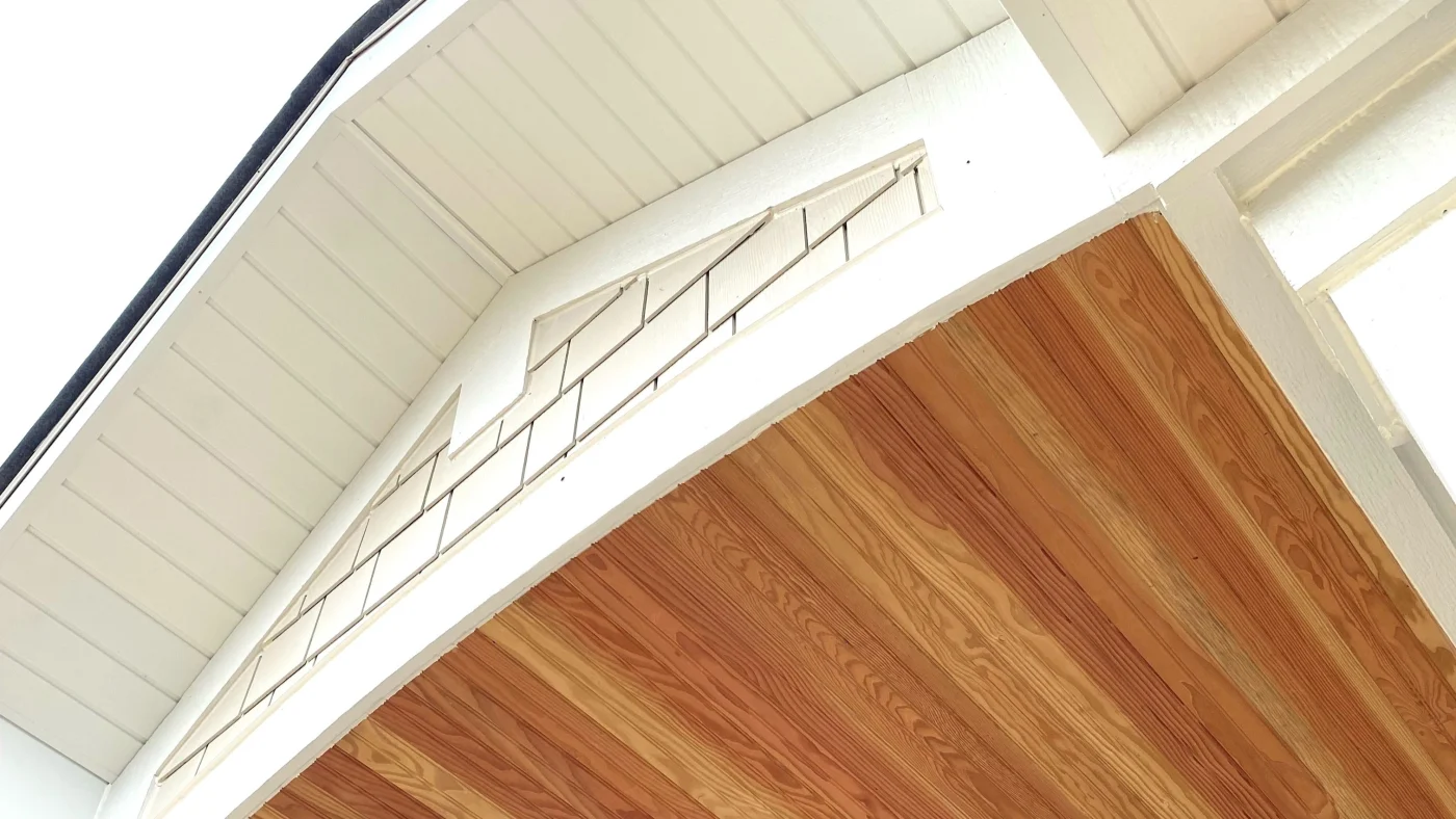 Reliable Exterior Home Remodeling Pros | Chicago, IL | Apex Exteriors, Inc. A close-up above of an entry door of the siding and part of the underside of the roof on a house in Chicago, IL, by Apex Exteriors, Inc.