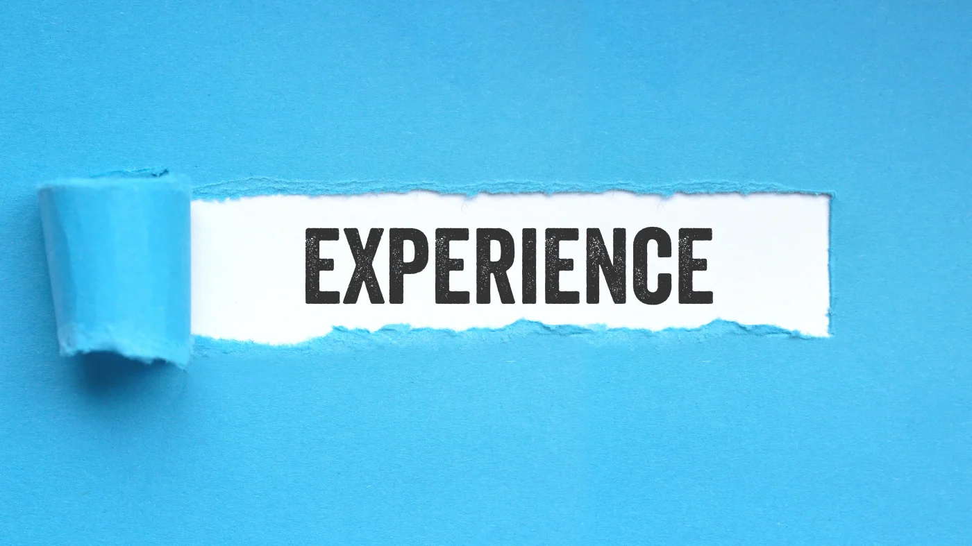 Incredible Exterior Home Remodeling Experts | Chicago, IL | Apex Exteriors, Inc. Part of a blue piece of paper pulled back to reveal the word “Experience.”