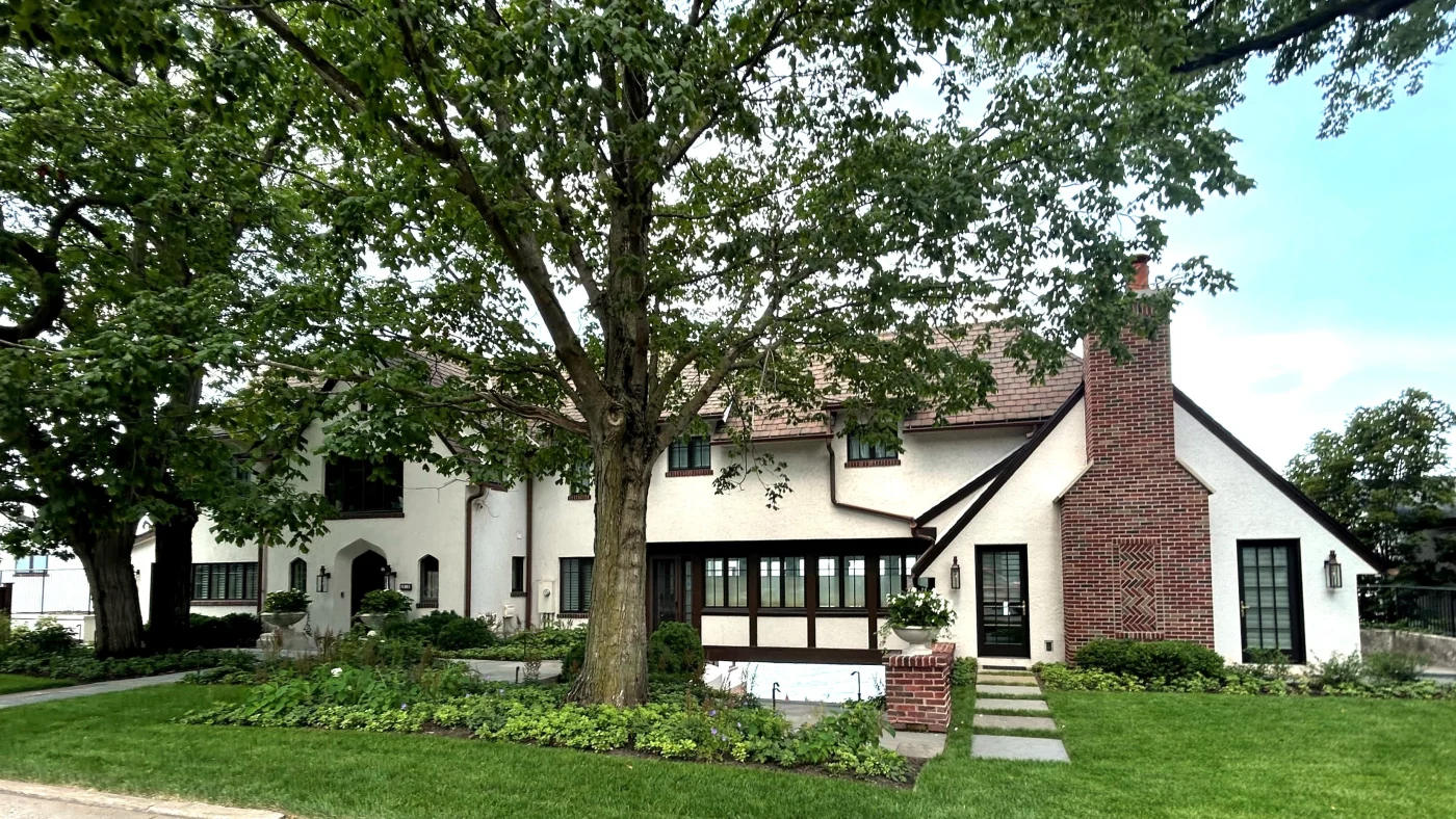 Exceptional Exterior Home Remodeling | Bloomingdale, IL | Apex Exteriors, Inc. A house with white siding and multiple beautiful windows in Bloomingdale, IL, by Apex Exteriors, Inc.