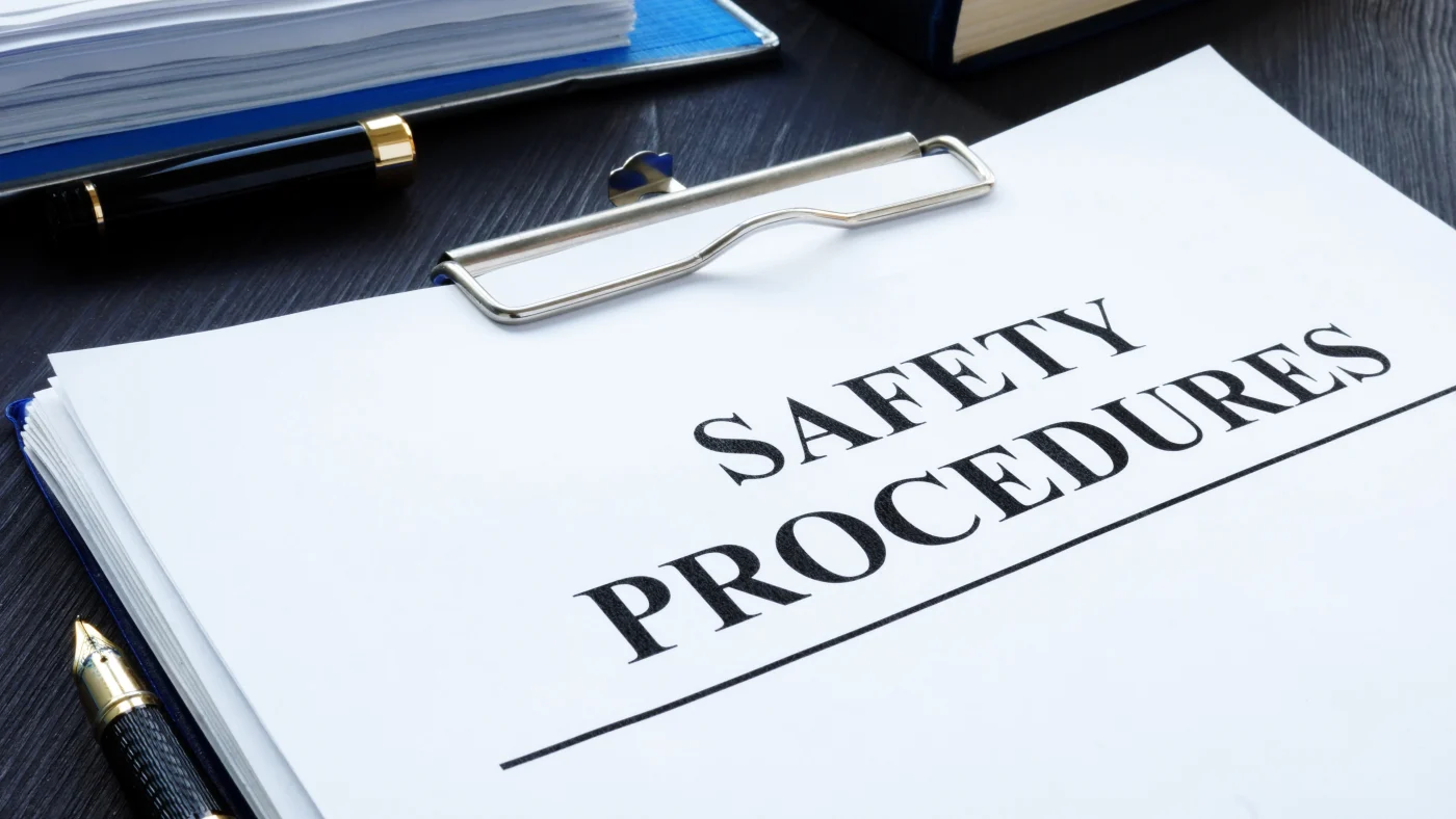 Safety-Focused Exterior Remodeling | Chicago, IL | Apex Exteriors, Inc. A close-up of a clipboard with words on the top sheet reading “Safety Procedures.”