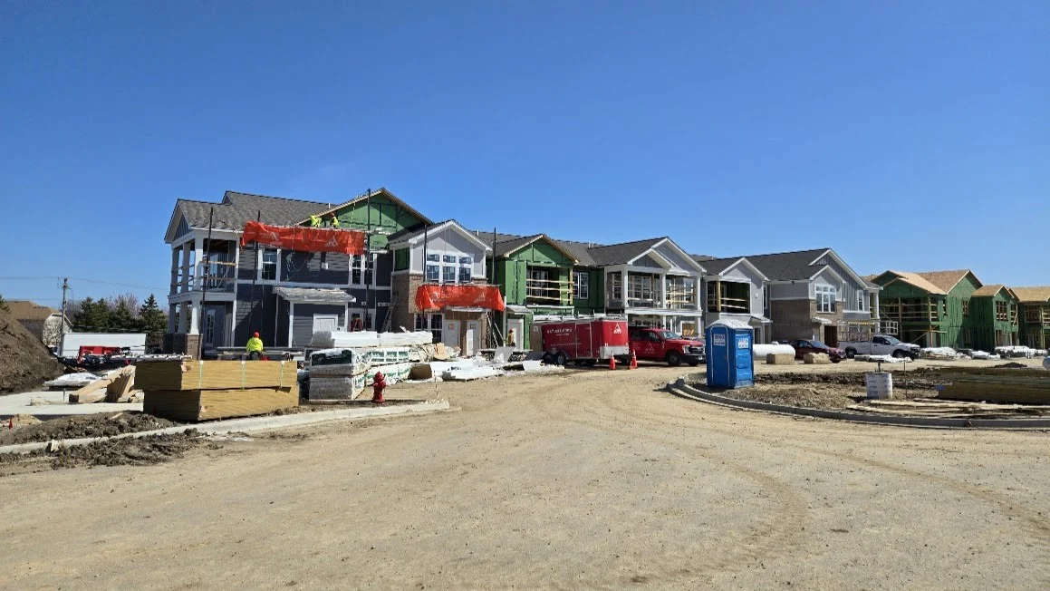 Reliable Multi-Family Exterior Services | Bartlett, IL | Apex Exteriors, Inc. Expansive multi-family construction project with roofing installation underway, showing coordinated building layouts, active jobsite equipment, and steady exterior progress across the development.