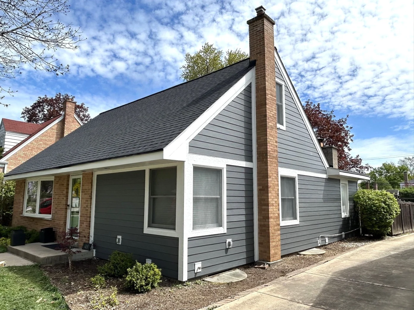 New James Hardie gray siding adorn a lovely residential property.