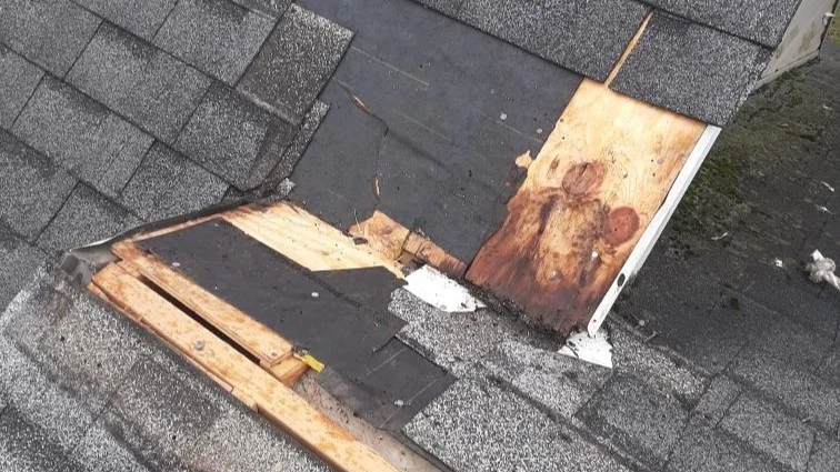 Outstanding Residential Roof Repair Elgin Il Apex Exteriors Inc Damaged roof section with missing shingles and exposed decking, highlighting the need for prompt repair to prevent leaks and further structural issues.