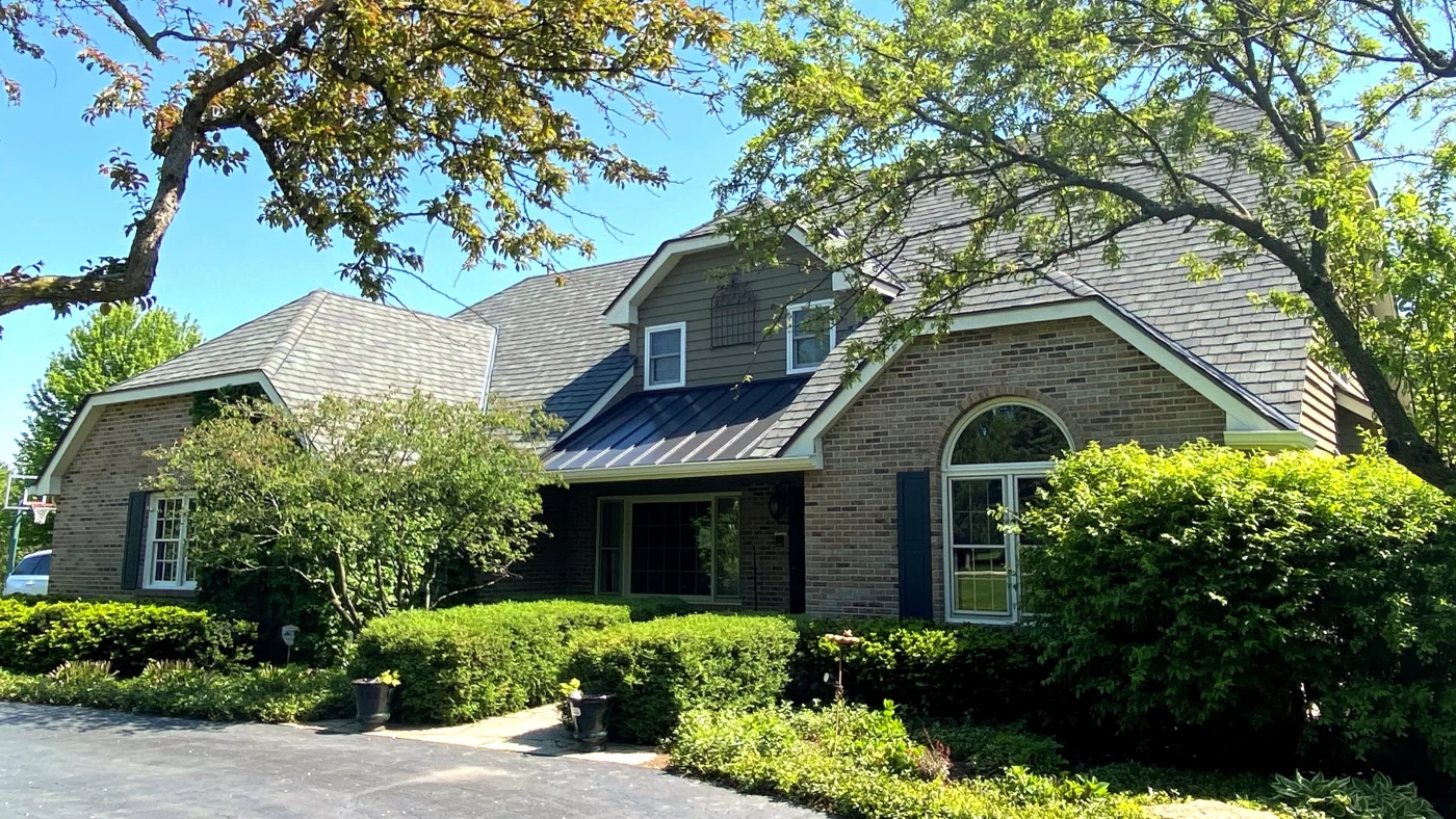 Outstanding Residential Roof Replacement Elgin Il Apex Exteriors Inc The front of a two-story house with a light-brown roof