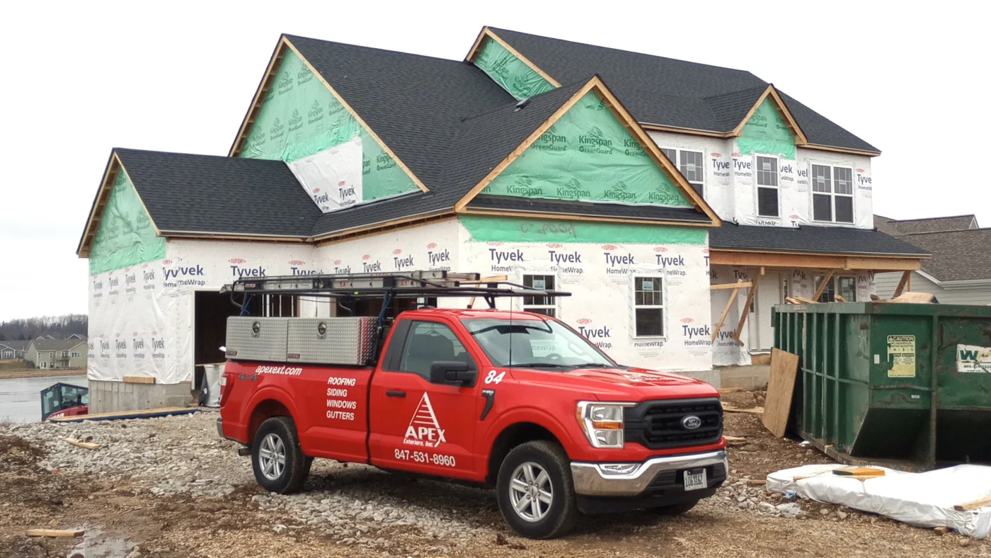 Exceptional HOA Exterior Services | Bartlett, IL | Apex Exteriors, Inc. Exterior renovation in progress with new weather barrier installation, preparing the home for upgraded siding and improved long-term protection.