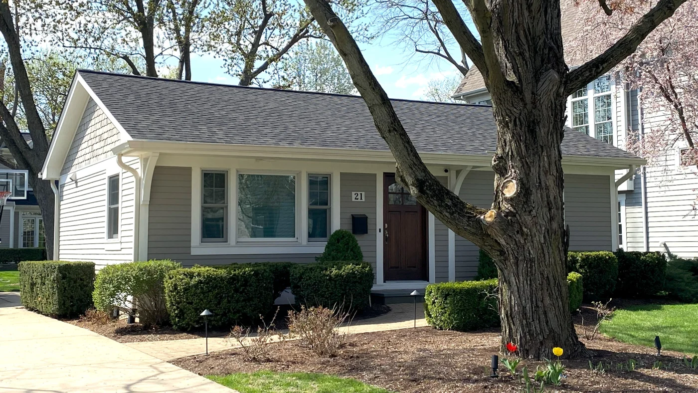 Superior Replacement Windows | Elgin, IL | Apex Exteriors, Inc. Inviting single-story home featuring updated windows that brighten the interior, improve energy efficiency, and complement the home's clean siding and well-kept landscaping.