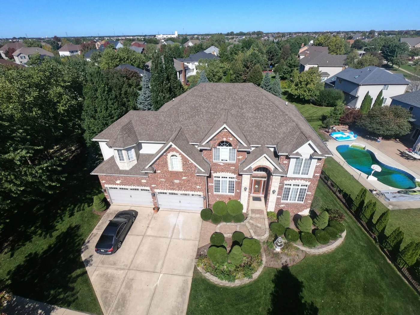A drone shot of a newly installed shingle roof on a South Elgin, IL home.