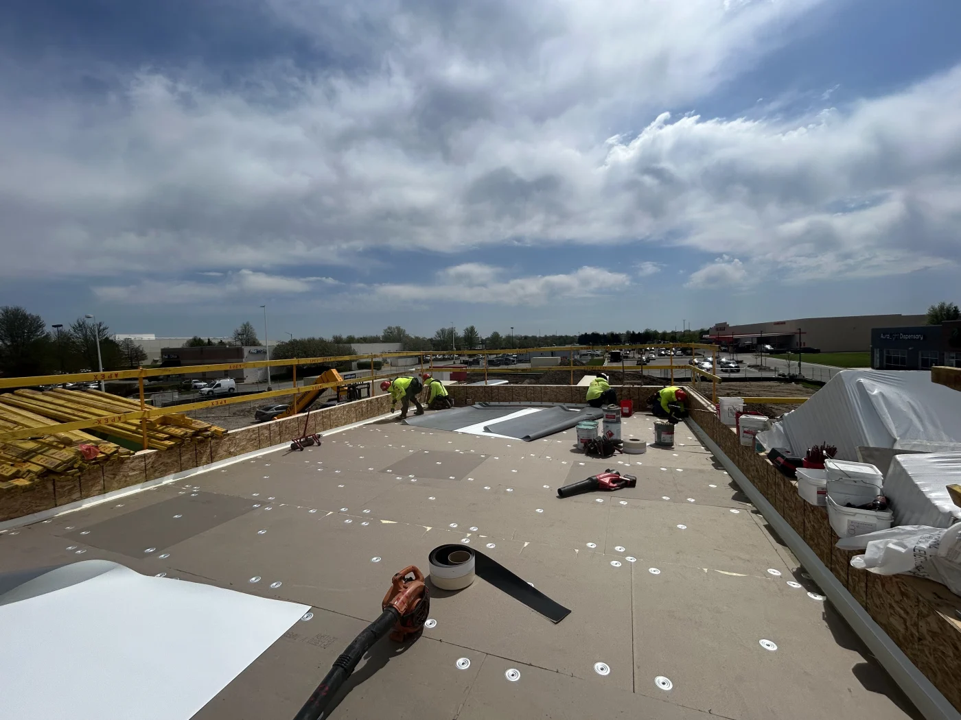 Image of a new commercial flat roof being installed on the top of a building in St. Charles, IL