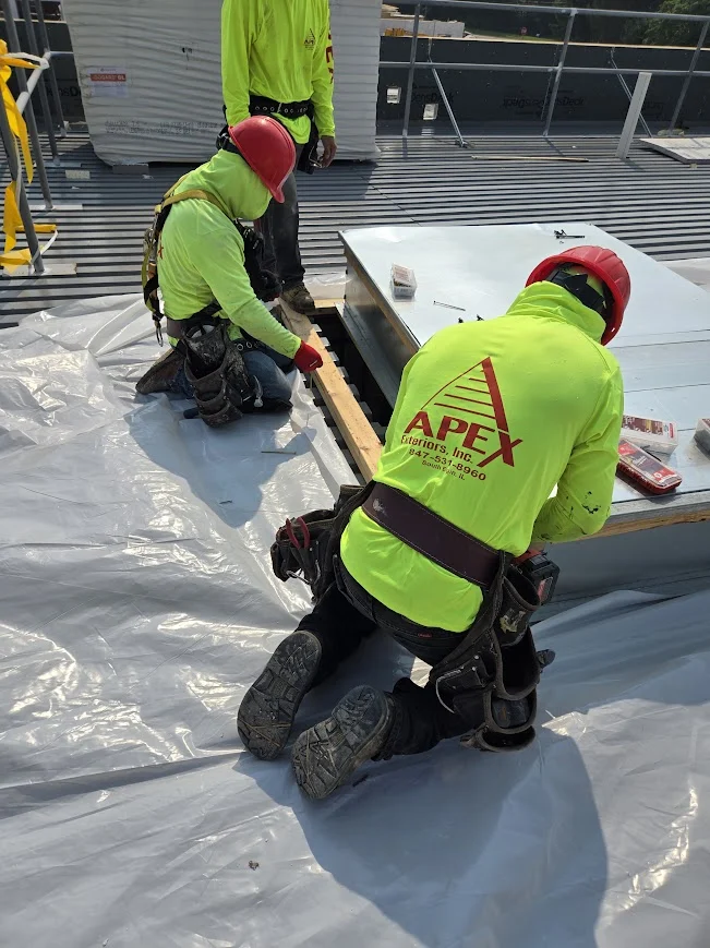 top of commercial flat TPO roof in South Elgin, IL being installed