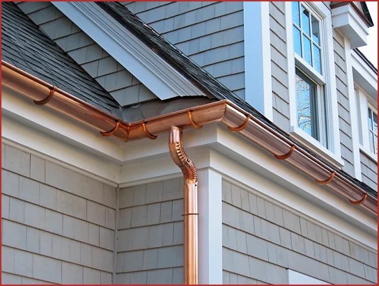 Custom copper half round gutters on a home in Wheaton, IL by Apex Exteriors.