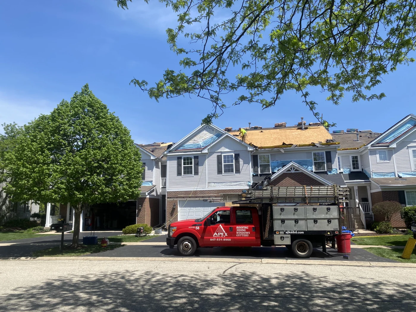HOA property in South Elgin having roofing replaced.