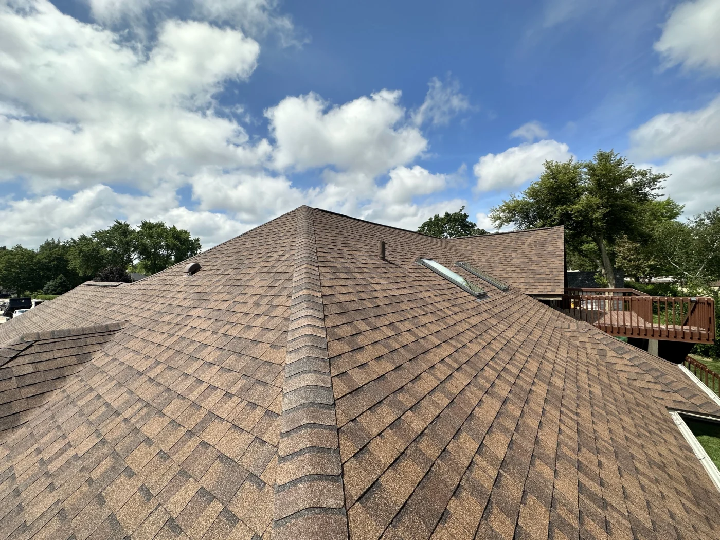 Exceptional Roofing Contractor | Bartlett, IL | Apex Exteriors, Inc. Newly installed brown shingle roof on home in Bartlett, IL.